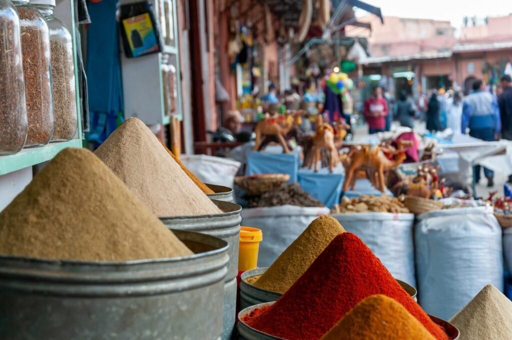Bustling Moroccan market with vibrant colors, spices, and textiles on